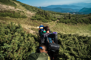 Fototapeta premium Group of hikers walking on a mountain. Carpathains, Ukraine