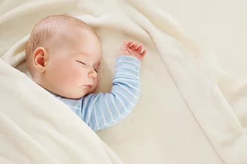 Fototapeten Baby sleeping covered with soft white blanket © candy1812