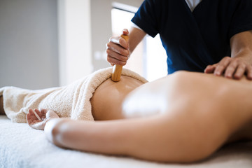 Masseur treating masseuse at wellness saloon