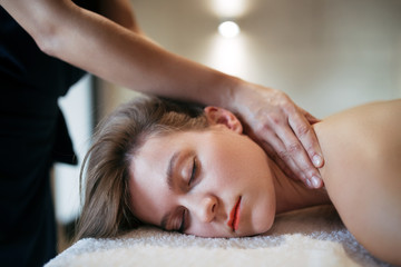 Fototapeta na wymiar Stress relieving massage by therapist