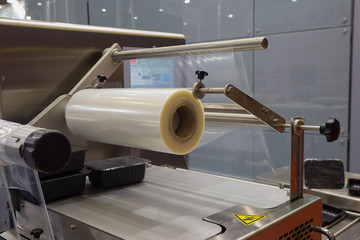 Machine for packing food products close-up. Industry