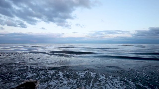 Cinematic view of the waves on the beach of Beddingestrand in Sweden.