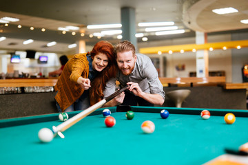 Couple dating and playing snooker