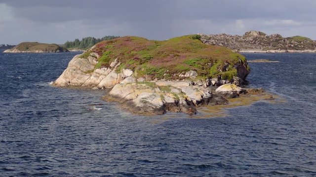 Seascape, Island on Norwegian fjord in sunny day, Averoy, Norway 

