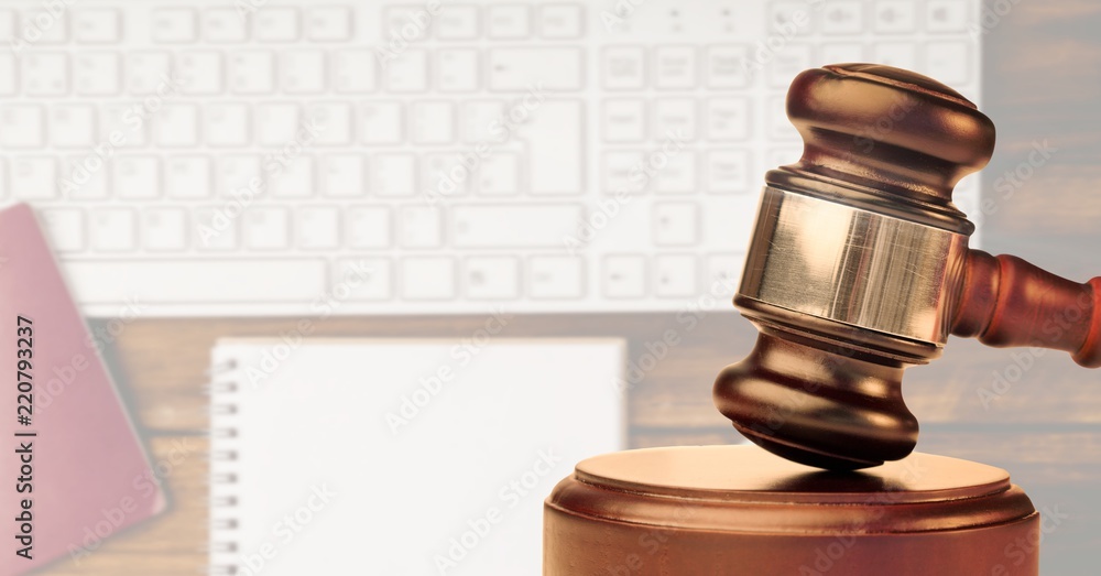 Poster gavel with keyboard and notebook in background