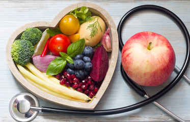 Healthy food in heart diet concept with stethoscope
