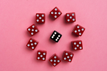 Red gaming dices on pink background. Flat lay, place for text. Game concept
