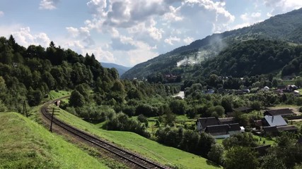 Mobile footage of the railway in the Carpathians at sunny day