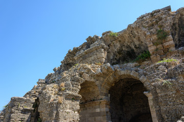 ruins of the ancient amphitheater with arched niches of the lower floors. Side, Turkey