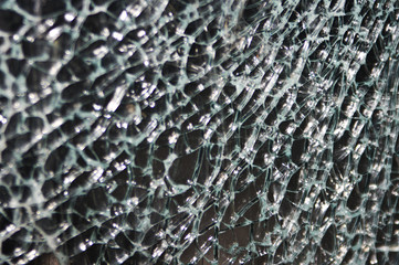  Texture of broken glass on dark background. Closeup