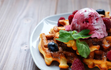 Belgian waffles with fresh berries and ice cream 