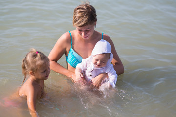 Mom with two children at sea