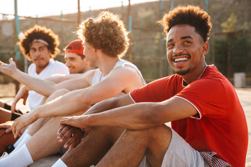 Group of young positive multiethnic men