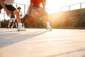 Fotobehang Cropped image of multiethnic men basketball players © Drobot Dean