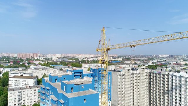 City, building crane, aerial view. Construction and Industry.
