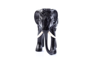 Black Engraved pattern gold elephant made of resin like wooden carving with white ivory. Stand on white background, Isolated, Art Model Thai Crafts, For decoration Like in the spa. 