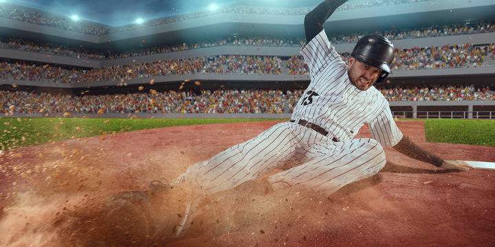 Baseball runner slide to the second base on professional baseball stadium