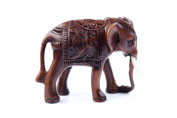 Brown Engraved pattern elephant made of resin like wooden carving with white ivory. Stand on white background, Isolated, Art Model Thai Crafts, For decoration Like in the spa.
