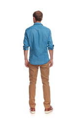 back view of a casual man standing