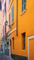 Fototapeta na wymiar Medieval halley with orange and pink facades. Brescia, Italy.