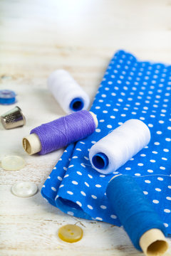 Sewing accessories and blue fabric