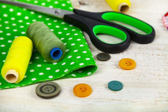 Sewing accessories and green fabric