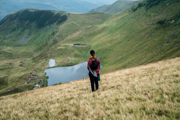 Fototapeta na wymiar Active hiker enjoying the view. Carpathians, Ukraine