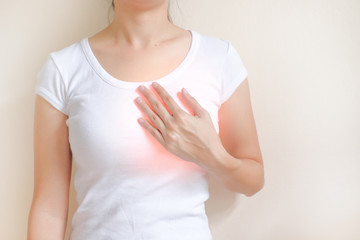 Woman suffering from chest pain on white background, Healthcare concept.