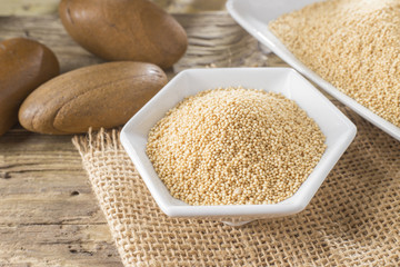 amaranth beans in bowl, on rustic wooden background