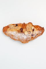 Freshly baked croissant with nuts