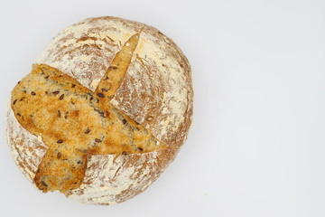 Freshly baked round bread on white background