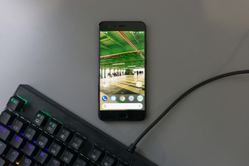 Hand holding Android Phone - With Keyboard