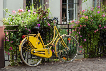 closeup of vintage yellow bicycle in the street