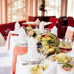 wedding tables in restairant, nobody at begining, red interior