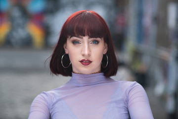 Portrait of young redhead with purple turtle neck