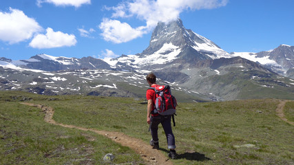 Fototapeta na wymiar Young Hiker in Alpine Mountains