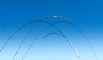 Streams and drops of water on a blue background