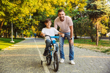 Happy father and his son having fun together