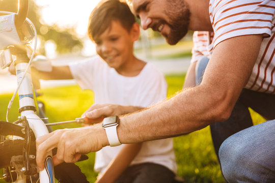 Cropped image of smiling father and his son - Powered by Adobe