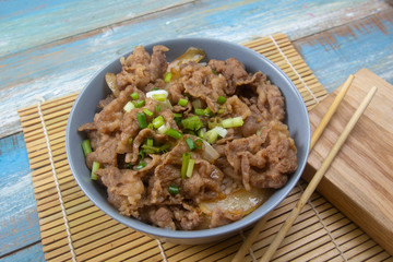 Cooked beef with rice on bowl