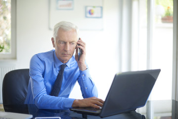 Businessman using his mobile phone