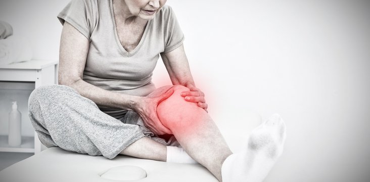 Composite image of senior woman with her hands on a painful knee