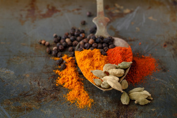 spices on a black rustic board