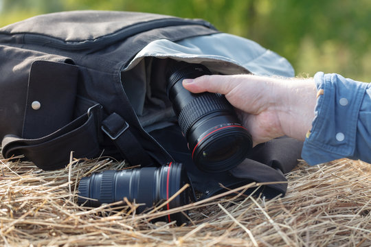 photographic lens is lying on a haystack, countryside protographer concept