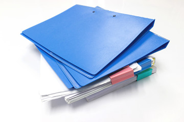 Blue files folder and paper on white table in office, concept Office supplies