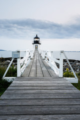 Marshall Point Light Station in Port Clyde, Maine with the Wooden Walkway  in the Foreground and Copy Space