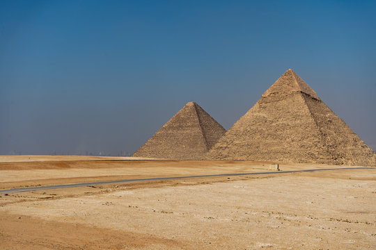 The three pyramids of the Necropolis of Giza, Khufu (Cheops), Khafra and Mankawra, outside Cairo, Egypt.