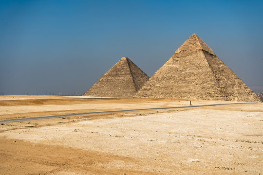 Egyptian pyramids on sky background.