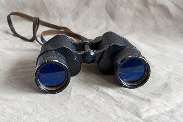 Old big binoculars close-up.