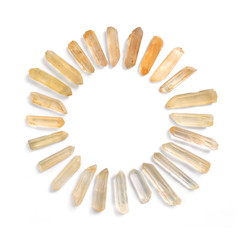 Circle frame of Lemurian quartz gemstones, isolated on white background